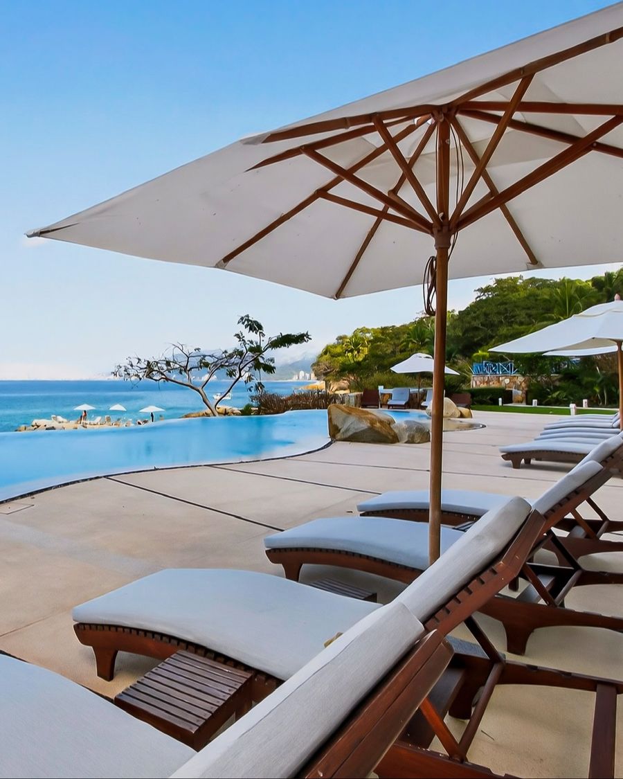 Umbrella and loungers beside the infinity pool in Puerto Vallarta