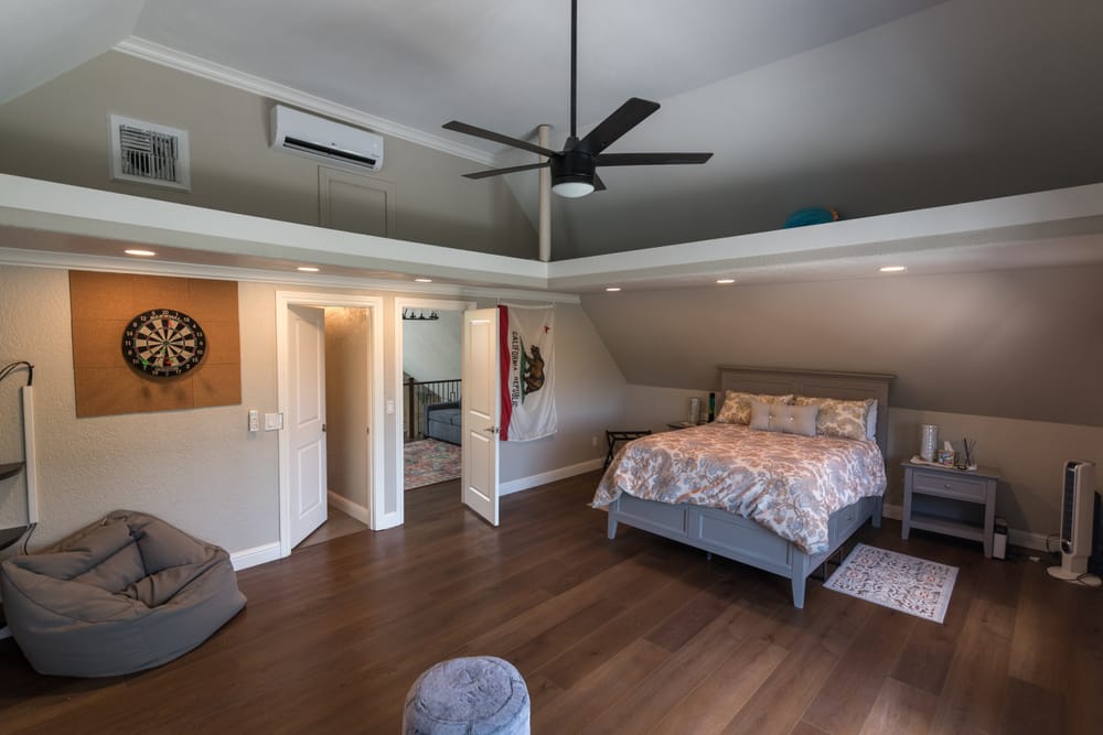 Bedroom with ceiling fan and beanbag chairs