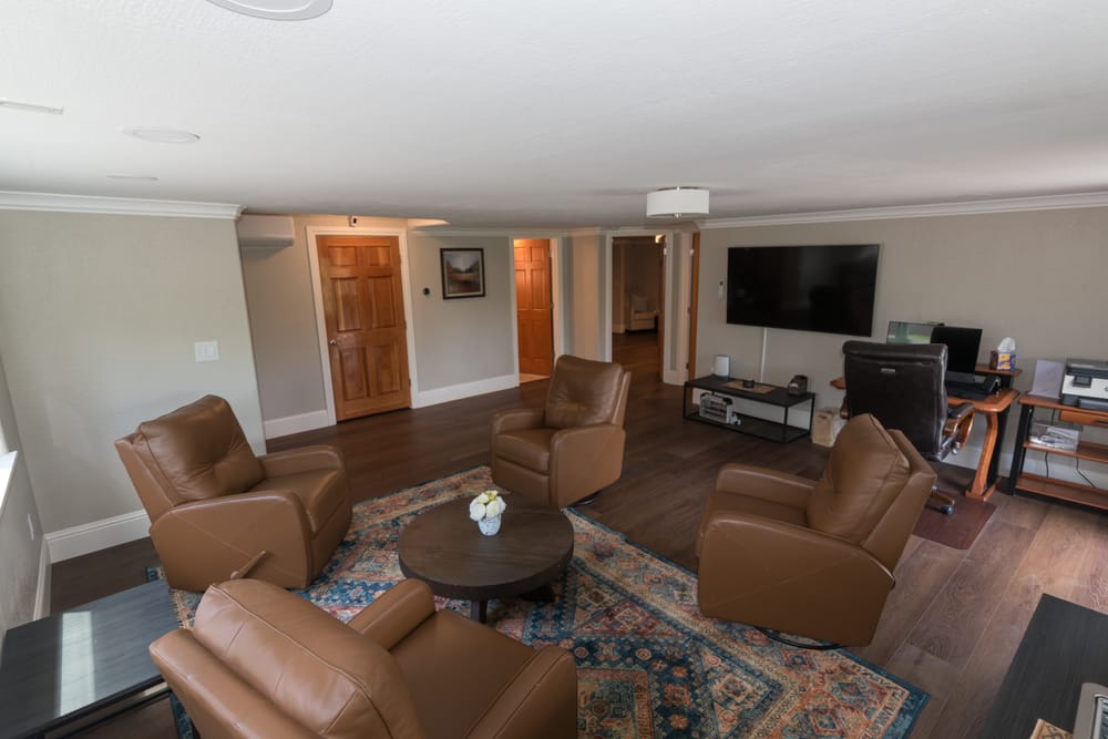 Downstairs family room with leather recliners and TV