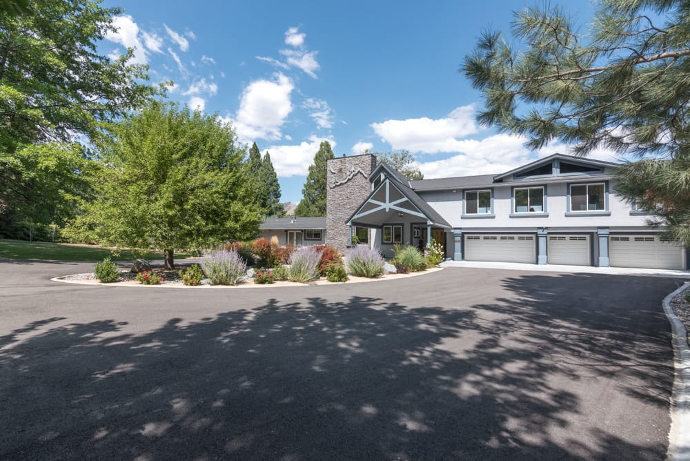 Front of the house with garages and landscaped drive