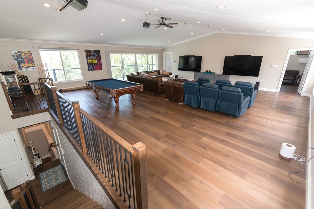 Upstairs game room with pool table and theater seating